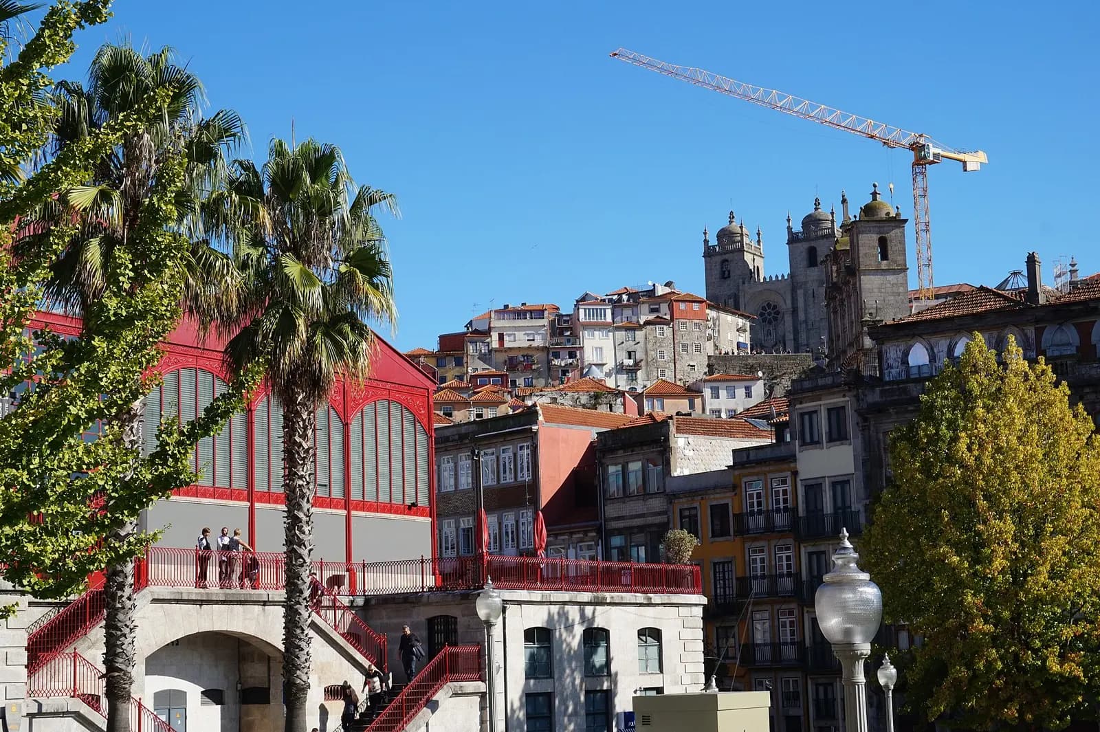 Red iron façade and glass galleries of Mercado Ferreira Borges in Porto